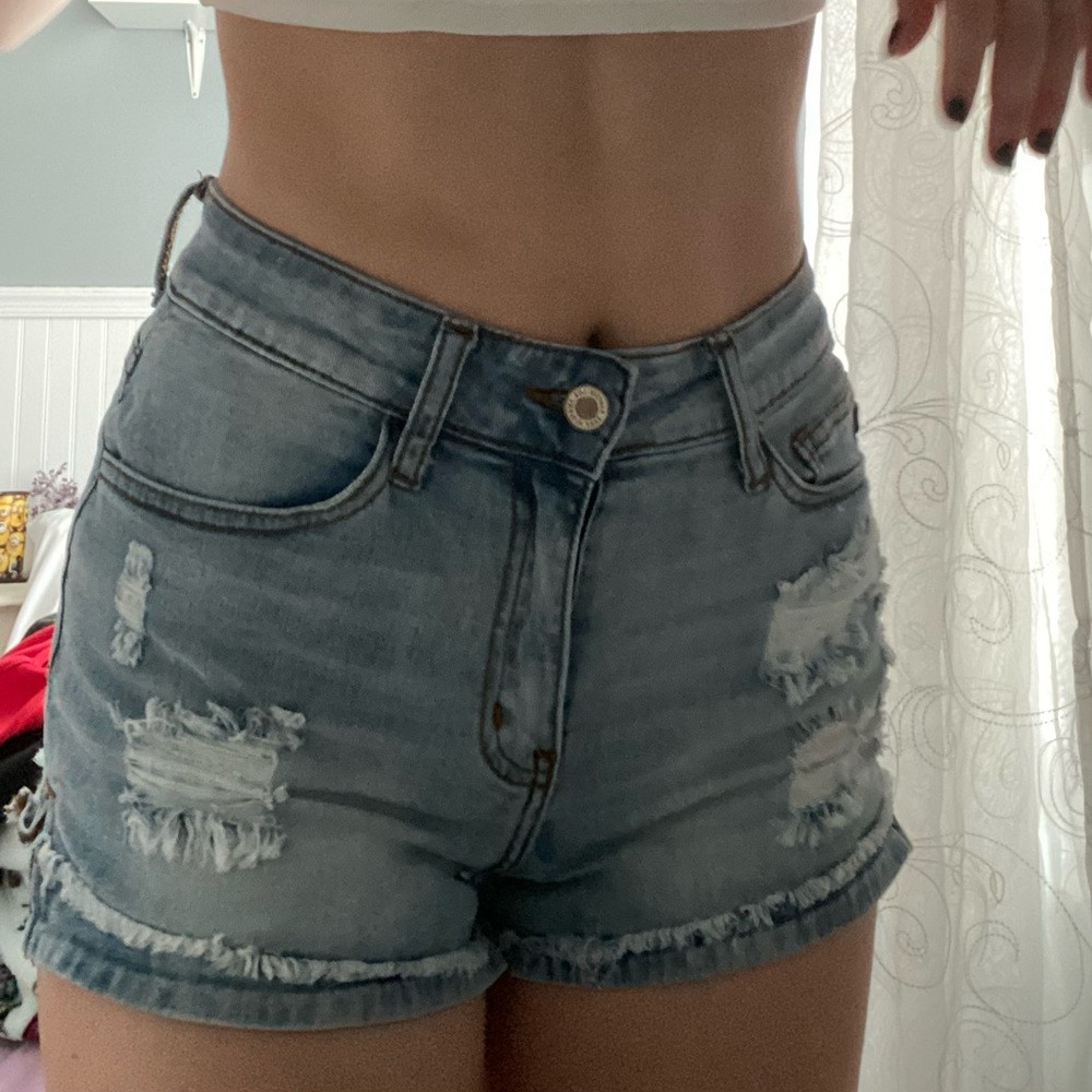 blue ripped and distressed kancan jean shorts